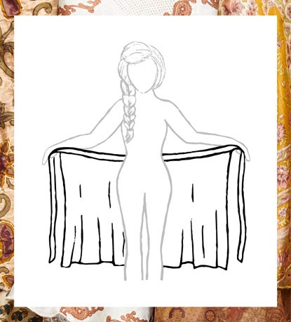 Hold skirt behind back, long layer facing in.